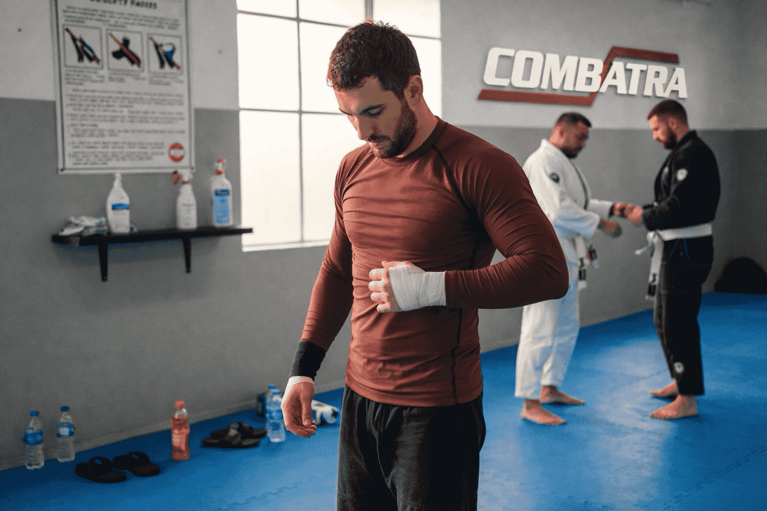 BJJ athlete putting on rashguard in Sydney gym