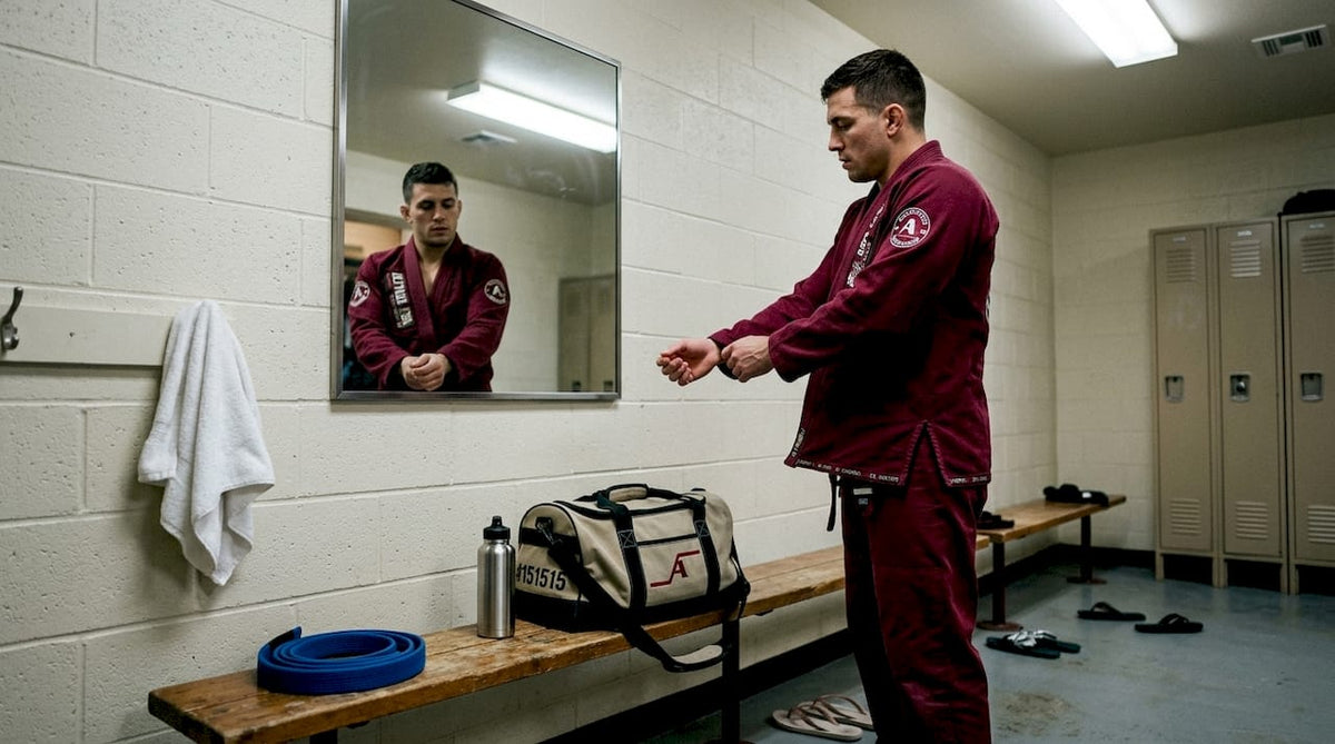 BJJ athlete adjusting custom gi in locker room