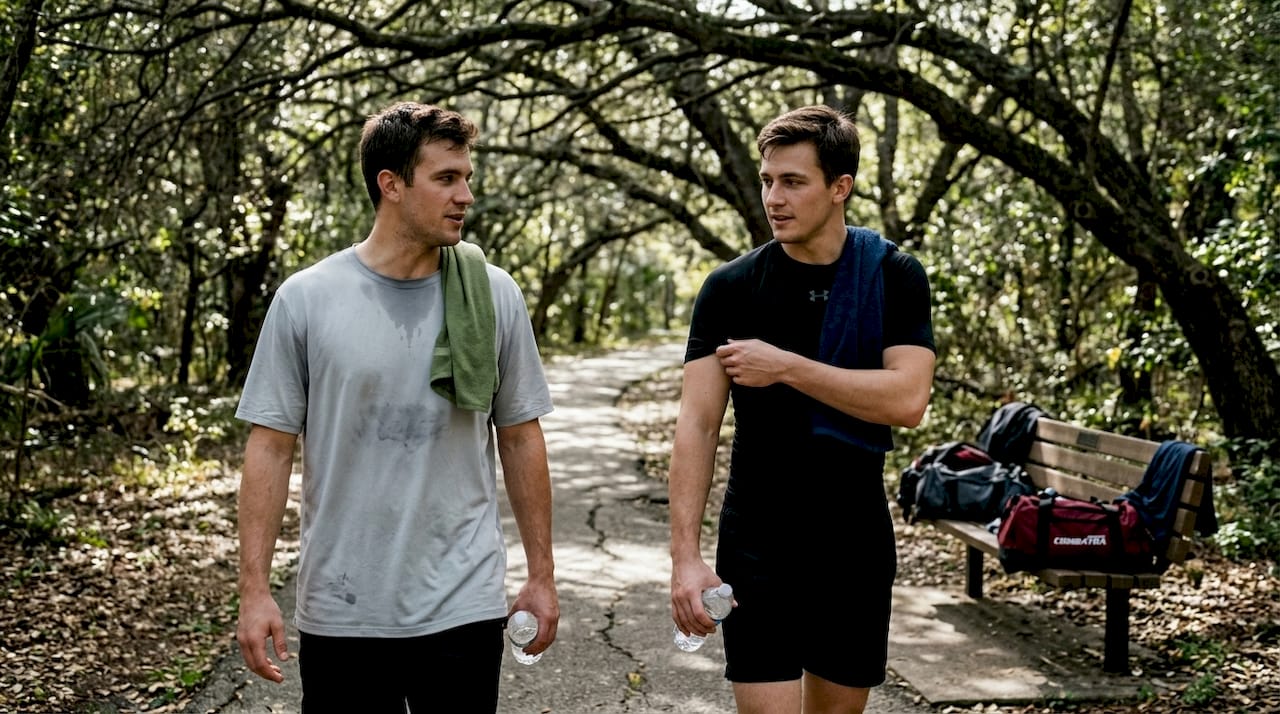 Athletes in compression and loose-fit shirts outdoors