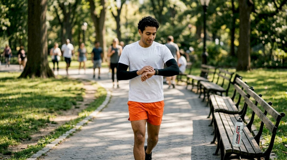 Runner in city park wearing UV arm sleeves