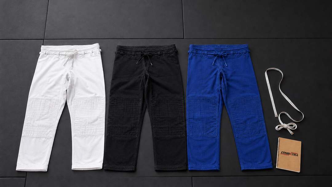 White black and blue BJJ gi pants comparison with a Combatra notebook