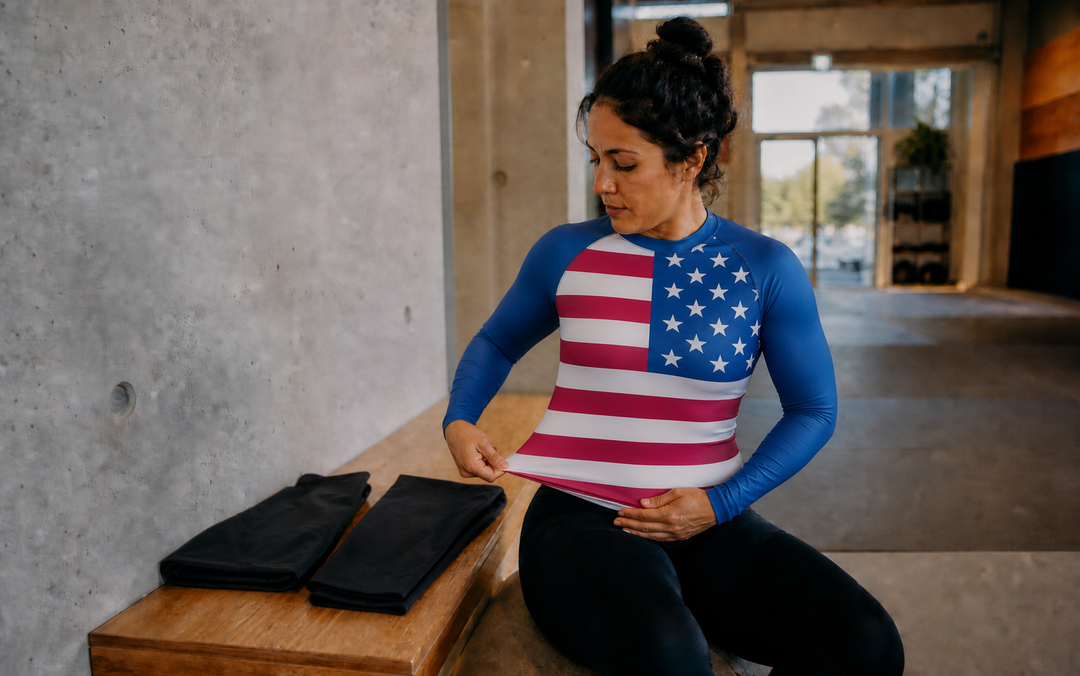 Women's BJJ Rashguard Australia: Build a Reliable No-Gi Top Layer hero editorial scene with product-accurate Combatra artwork and a natural side-hem fit check