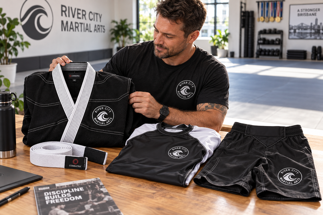 Australian martial arts academy team reviewing a finished branded Combatra club kit for summer