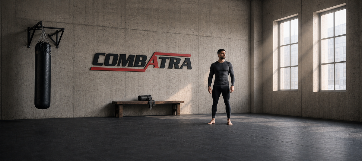 Full-length athlete in black compression wear beside a physical Combatra wall logo