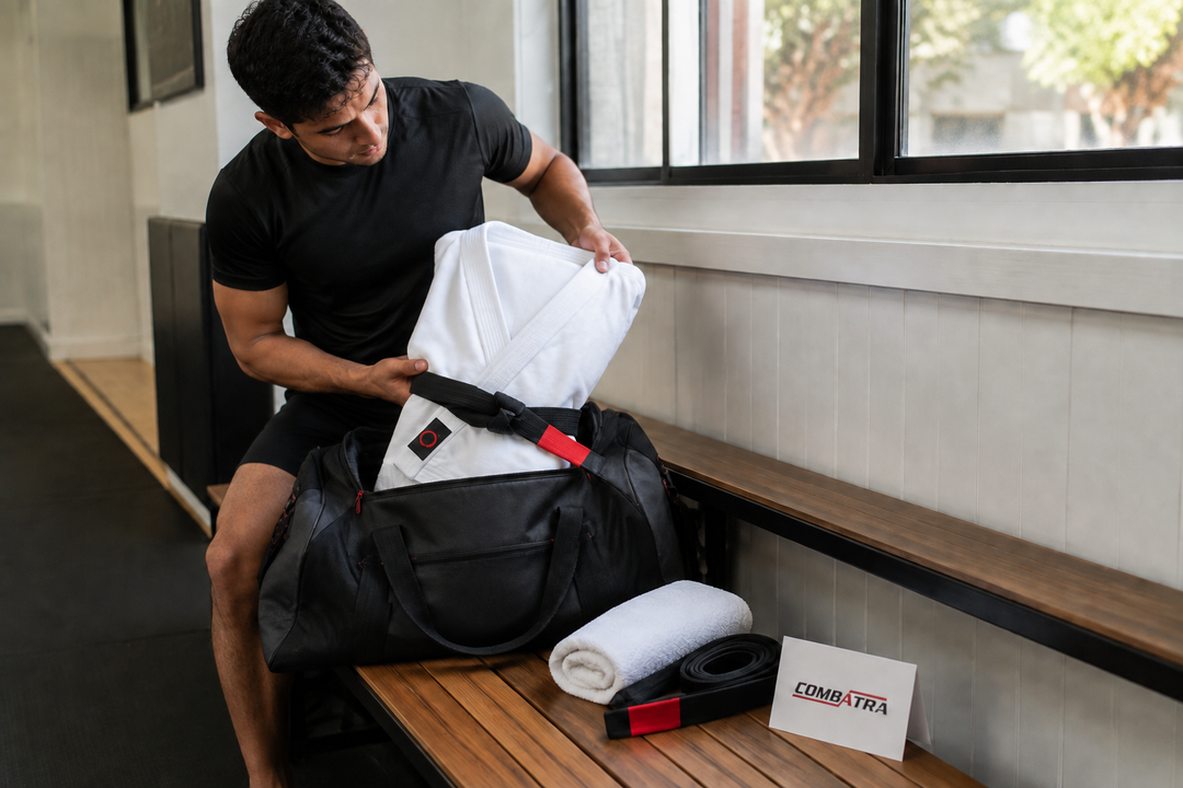 Packing a white Combatra Gi on an academy bench.