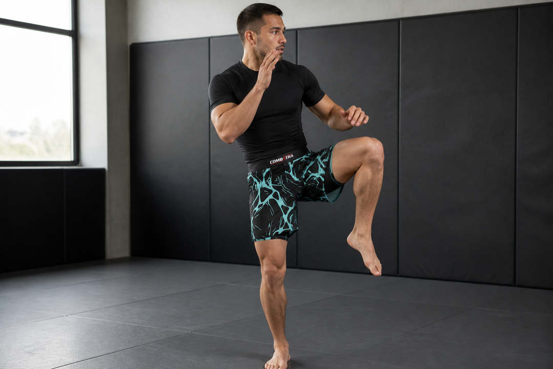 Athlete wearing Combatra Energy Tiger compression shorts under matching MMA shorts